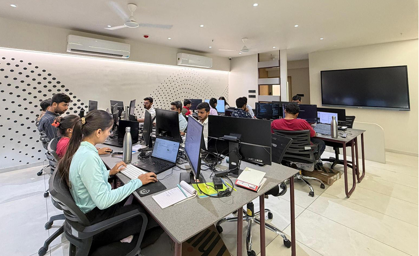 Developers at their desks in the Untie-it office